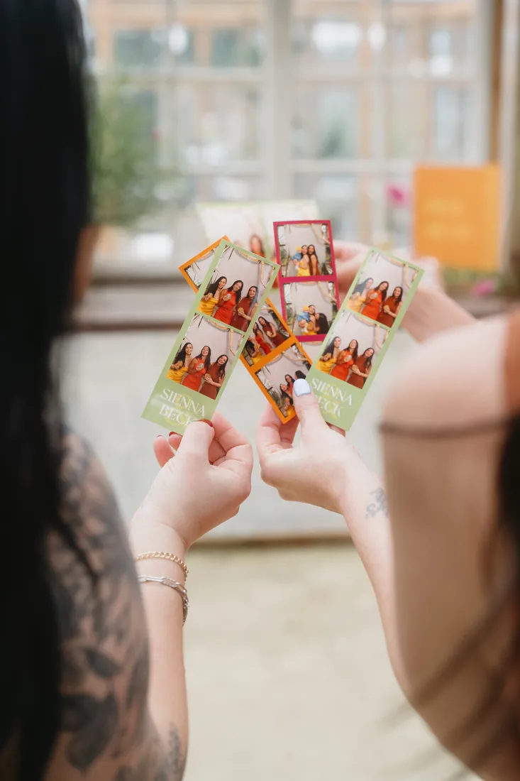 Guests holding photo strips at Dos Palomas Ranch